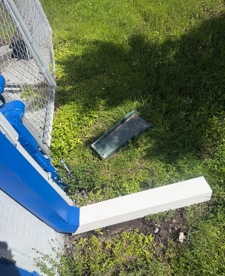 New white extension added to a 4x5 downspout, carrying water away from a commercial building in Cape Coral, FL