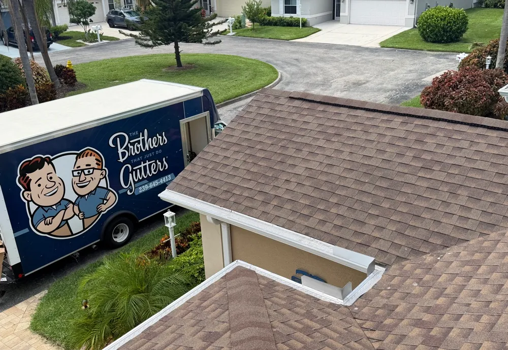 Brothers Gutters truck parked beside a home with newly installed seamless gutters in Fort Myers, FL