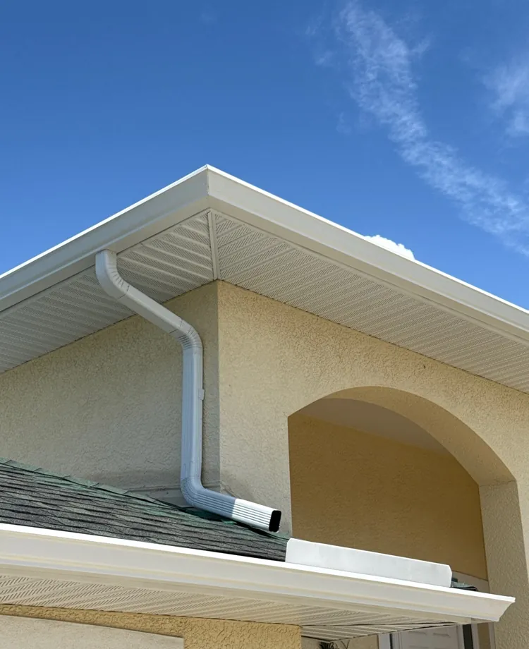 New white aluminum soffit, fascia wrap and seamless gutter on a home in Fort Myers Beach, FL