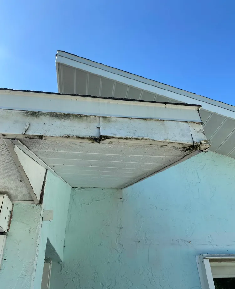 Rotted fascia wood at a roof corner before repair on a home in Fort Myers, FL