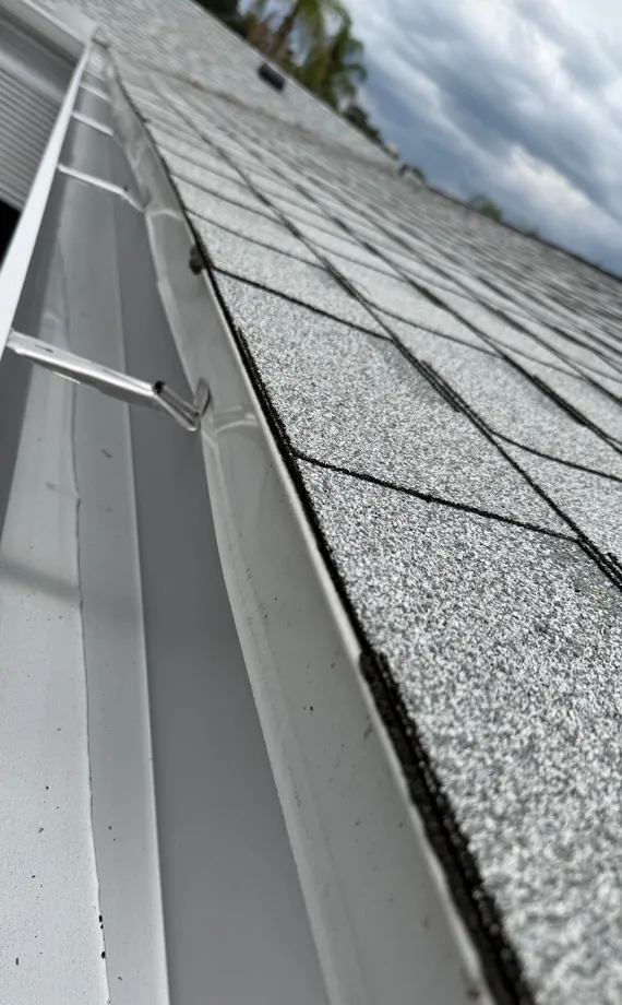 Close-up of a white seamless gutter with hidden hangers in North Fort Myers, FL
